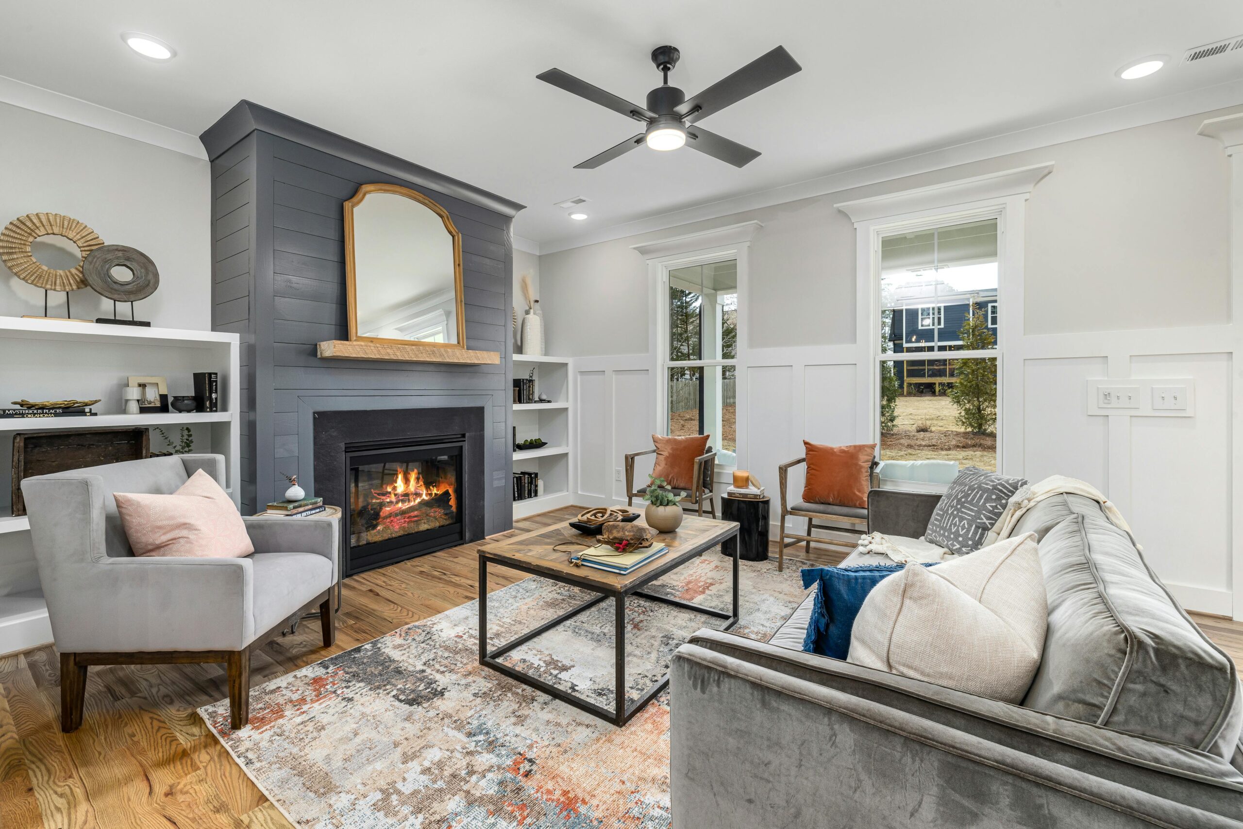 Cozy living room painted by Luxury Dallas Painters, A stylish and comfortable living room featuring a modern fireplace and chic furniture.